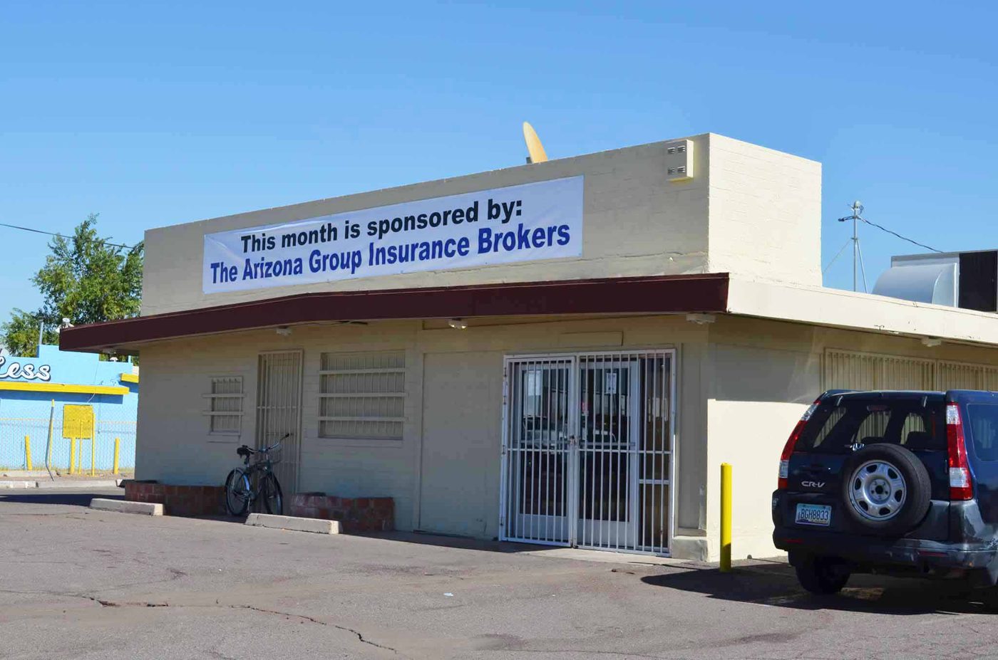 Sponsor recognition banner on 7th Street Food Pantry building