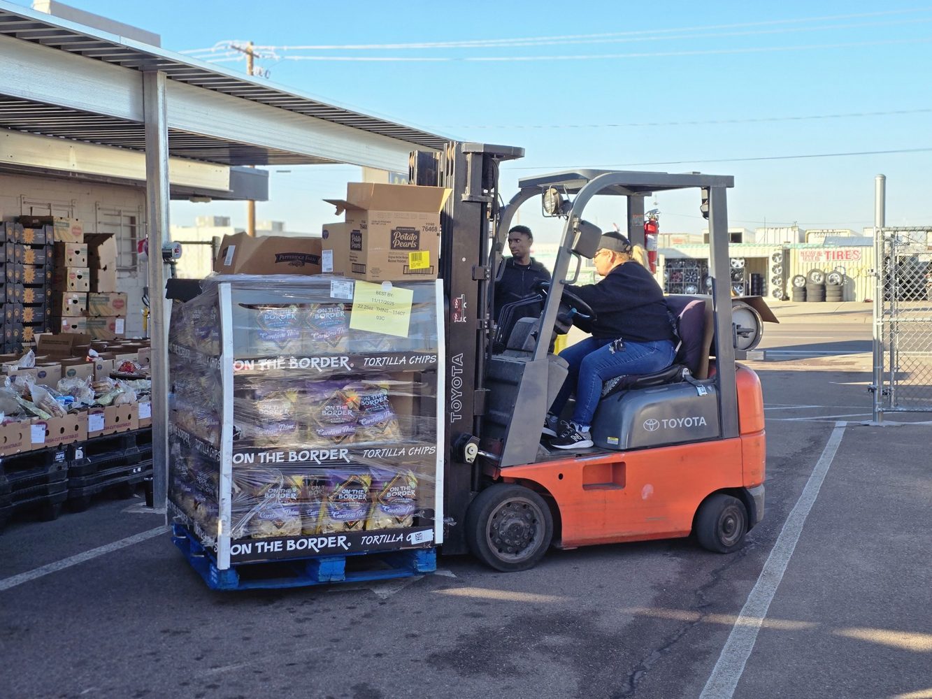 Food pallets being moved for Thanksgiving outreach