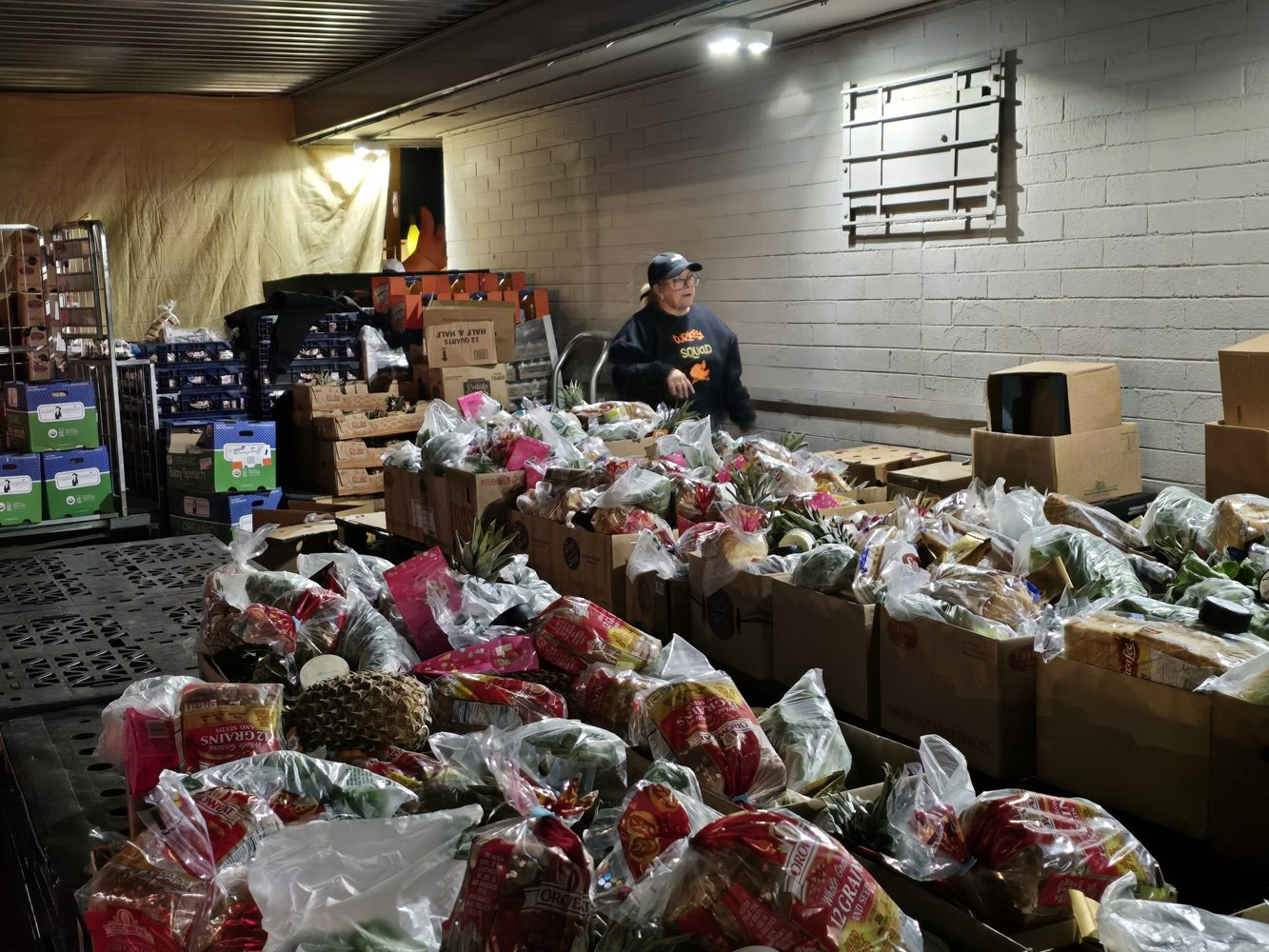 Volunteers preparing Thanksgiving food boxes