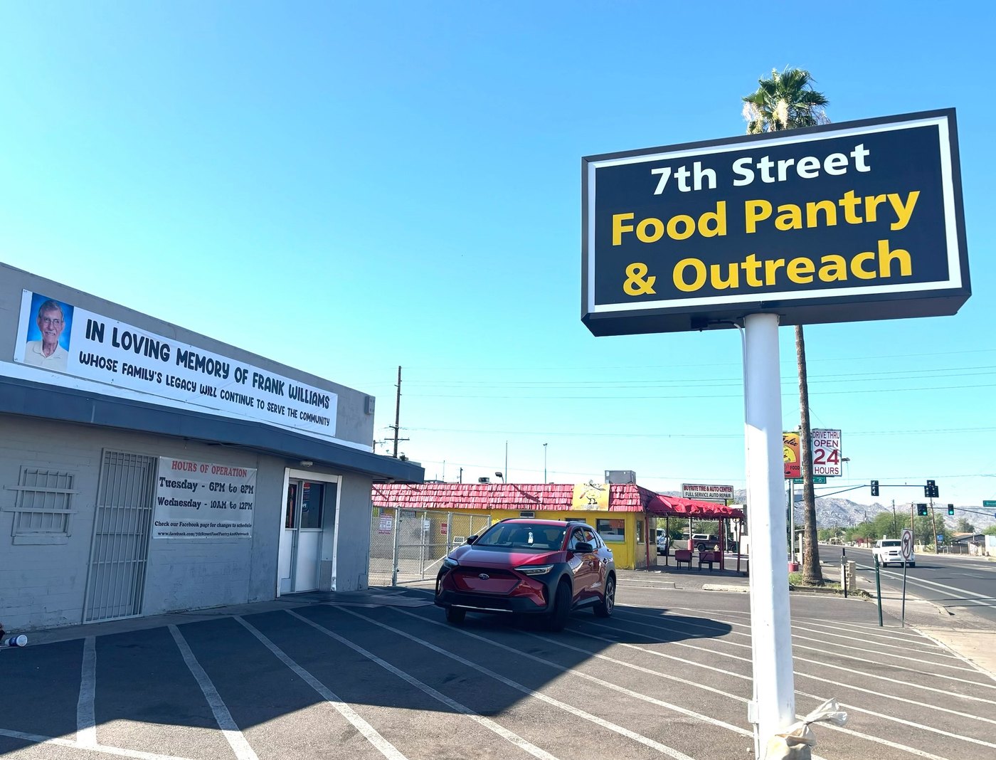 7th Street Food Pantry building with memorial banner for Frank Williams